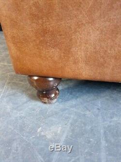2004. Chesterfield tan Distressed Vintage Club Leather Armchair Courier Available