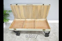 Industrial style wooden coffee table with wheels and hidden storage