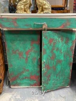 Kitchen 1960s unit vintage, retro cabinet, distressed paint. Funky and bright