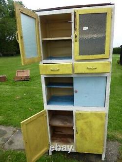 Vintage 1940s kitchen cupboard with three compartments. Two drawers