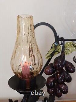 Vintage decorative wrought iron wine dispenser with glass candle vase