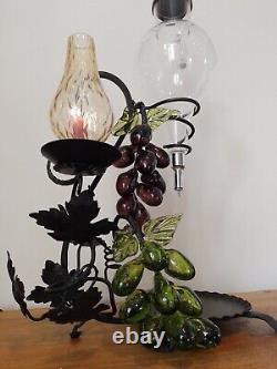 Vintage decorative wrought iron wine dispenser with glass candle vase