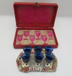 Vintage oriental saki set with a tray, cobalt blue shots in silver cups