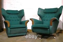 Vintage pair of retro wingback buttoned armchairs