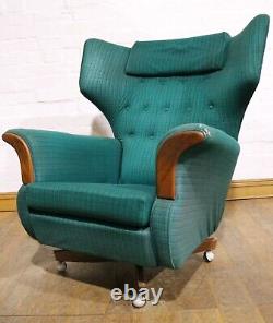 Vintage pair of retro wingback buttoned armchairs