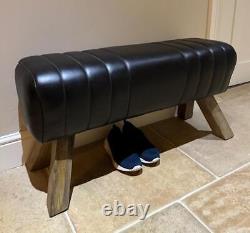 Banc en cuir noir, pieds en bois, style cheval d'arçon, rétro vintage