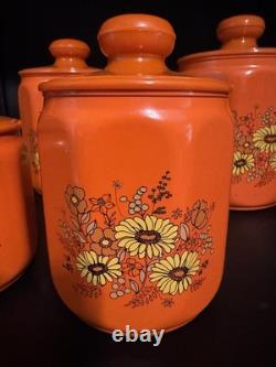 Ensemble de 4 canisters en aluminium Kromex fleurs décor rétro des années 1970 orange