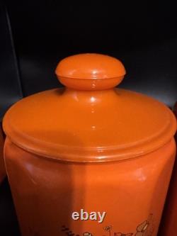 Ensemble de 4 canisters en aluminium Kromex fleurs décor rétro des années 1970 orange