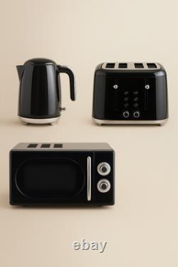Ensemble de cuisine noir rétro élégant vintage : bouilloire, toaster, micro-ondes, friteuse à air.